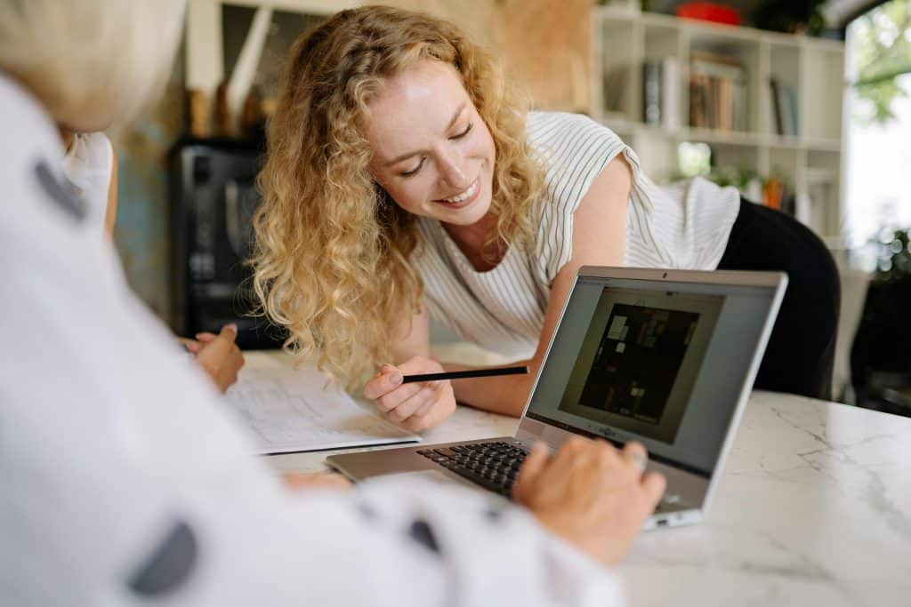 two people looking at laptop together